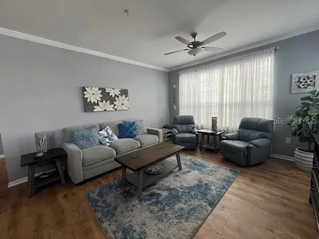 a living room with furniture and a large window