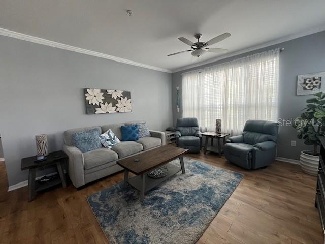 5591 Rosehill Road, Unit 102 Sarasota, FL 34233 - Photo 5 of 20 a living room with furniture and a large window