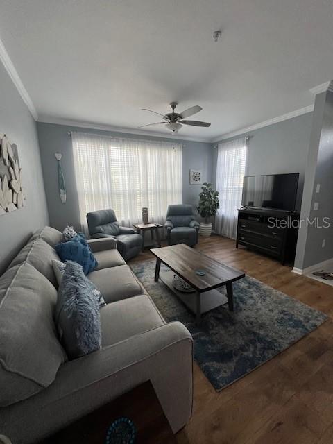 5591 Rosehill Road, Unit 102 Sarasota, FL 34233 - Photo 7 of 20 a living room with furniture a flat screen tv and a window