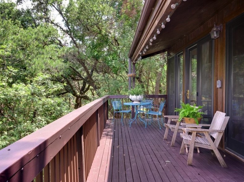 3 Hull Circle Austin, TX 78746 - Photo 12 of 32 a view of balcony with chairs and wooden fence