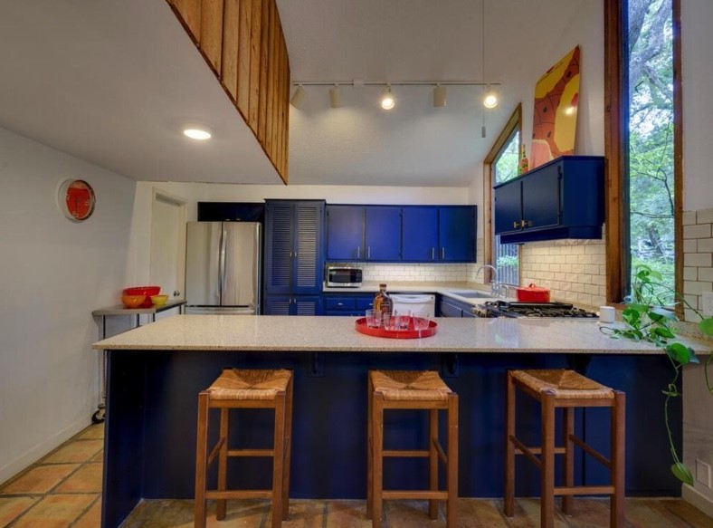 3 Hull Circle Austin, TX 78746 - Photo 14 of 32 a kitchen with stainless steel appliances granite countertop a sink and cabinets