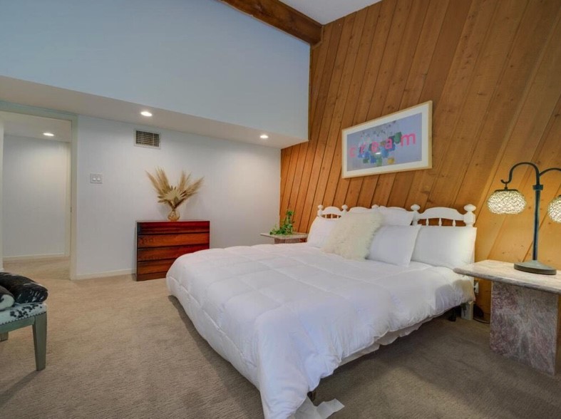 3 Hull Circle Austin, TX 78746 - Photo 16 of 32 a bedroom with bed and window