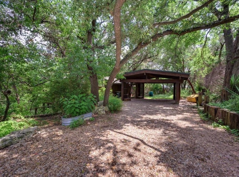 3 Hull Circle Austin, TX 78746 - Photo 30 of 32 a view of a small house with large trees