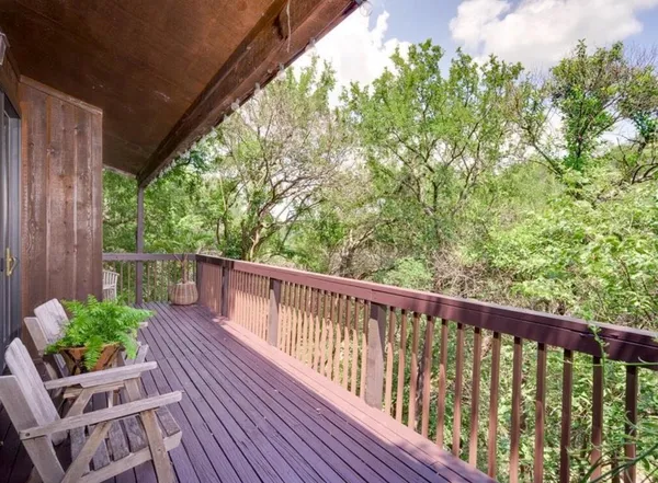 a view of balcony with furniture