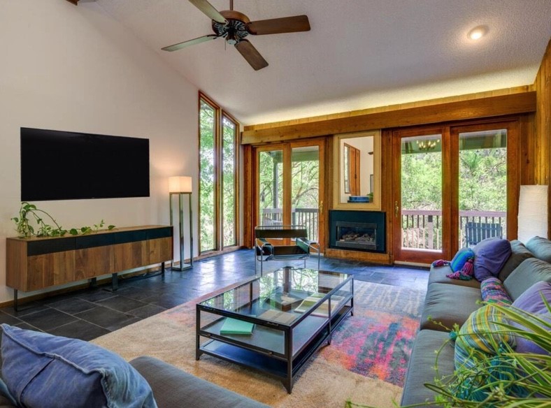 3 Hull Circle Austin, TX 78746 - Photo 7 of 32 a living room with furniture and a flat screen tv