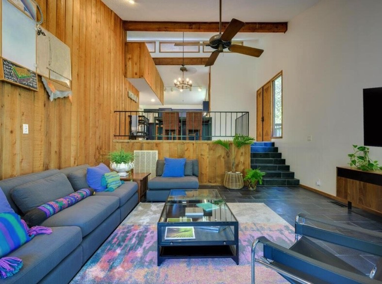 3 Hull Circle Austin, TX 78746 - Photo 8 of 32 a living room with furniture and a flat screen tv