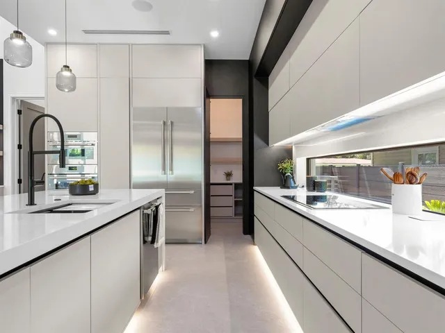 a living room with furniture a flat screen tv and a window