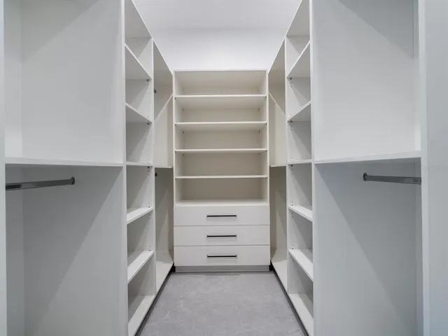 a bathroom with a toilet sink vanity and mirror