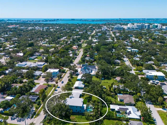 a view of a hallway view with wooden floor and staircase