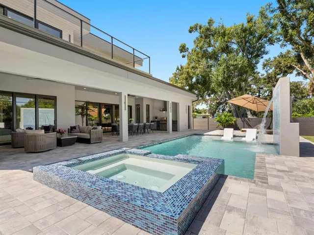 a view of a swimming pool with a porch