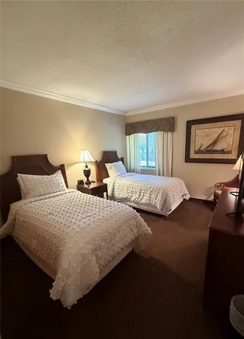 an aerial view of a house with a yard basket ball court