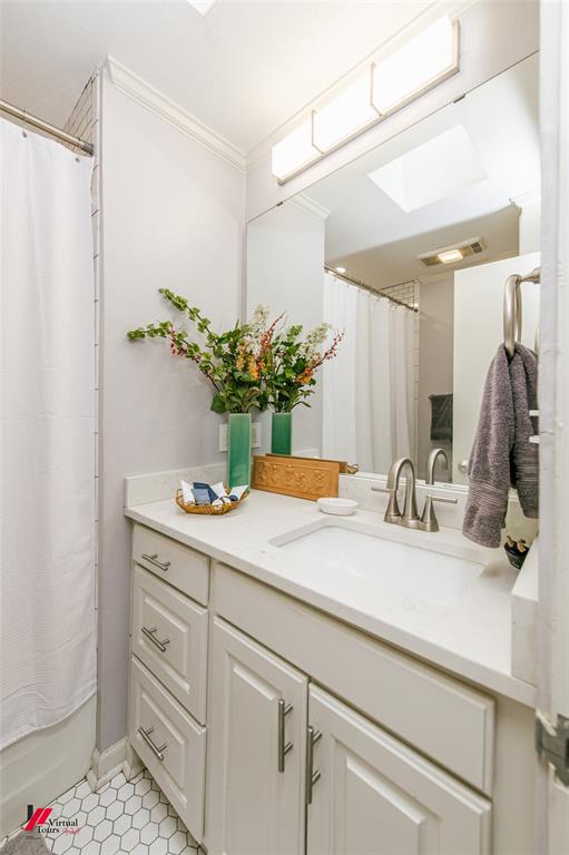 5822 River Road Shreveport, LA 71105 - Photo 24 of 35 a bathroom with a sink and a mirror