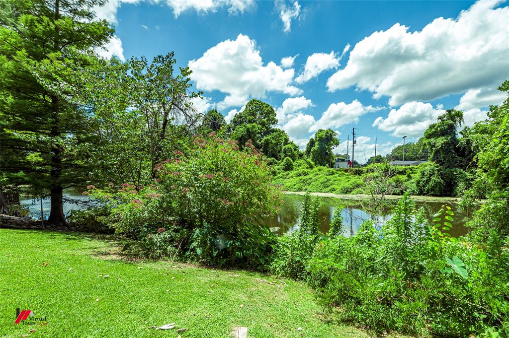 5822 River Road Shreveport, LA 71105 - Photo 28 of 35 a view of a lake in between two of trees