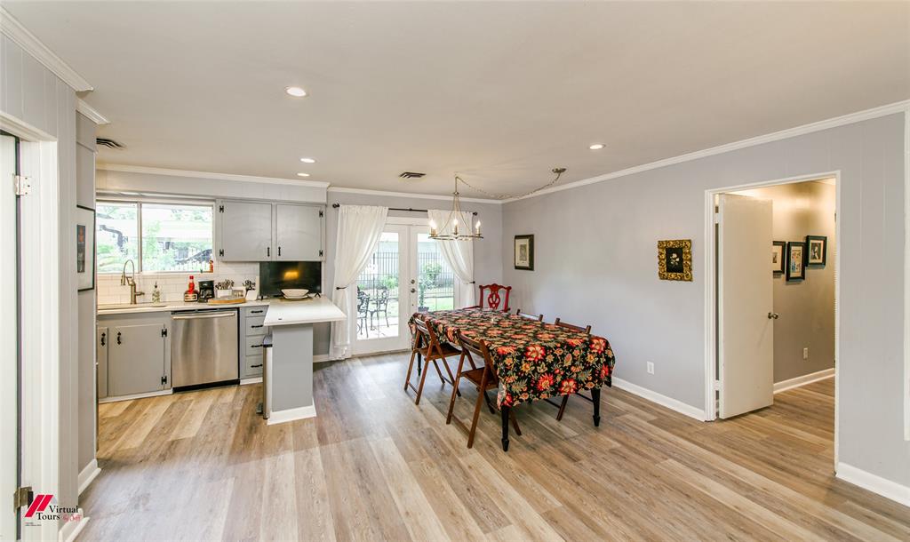 5822 River Road Shreveport, LA 71105 - Photo 6 of 35 a kitchen with refrigerator and cabinets