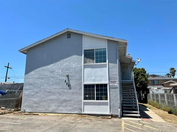a front view of a house with parking area