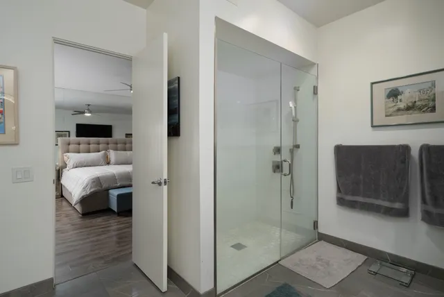 a spacious bathroom with a double vanity sink and a mirror
