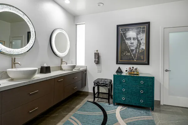 a bathroom with a sink a toilet and a mirror