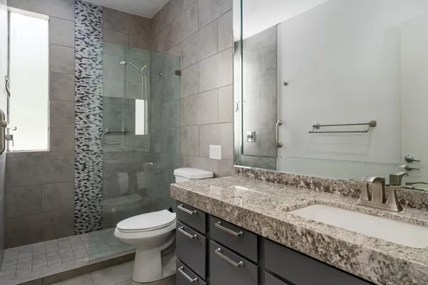 a living room filled with furniture and a flat screen tv