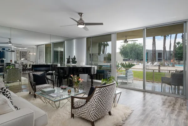 a living room with furniture and a large window
