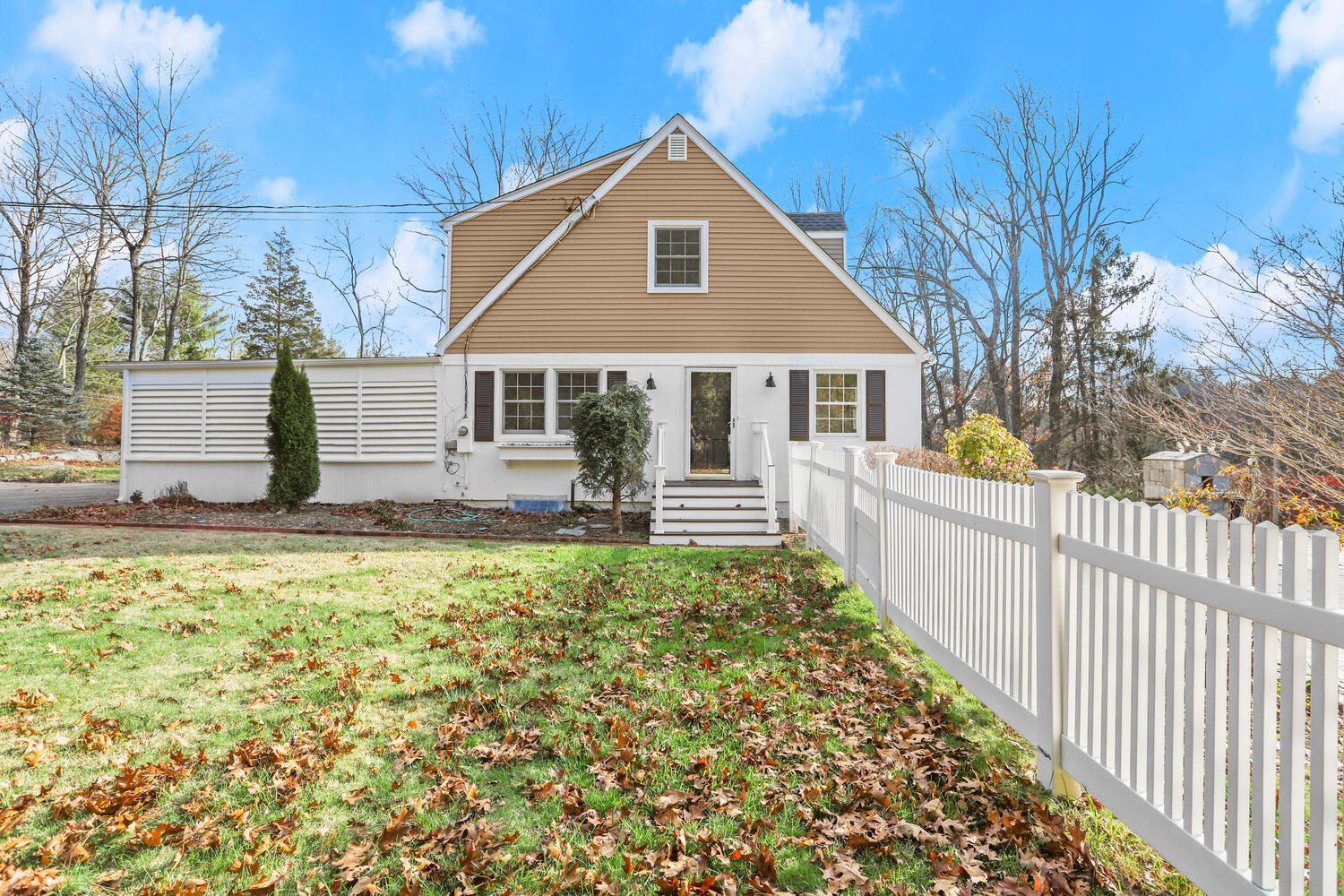 270 Smith Ridge Road New Canaan, CT 06840 - Photo 1 of 36 a front view of house with yard and trees around