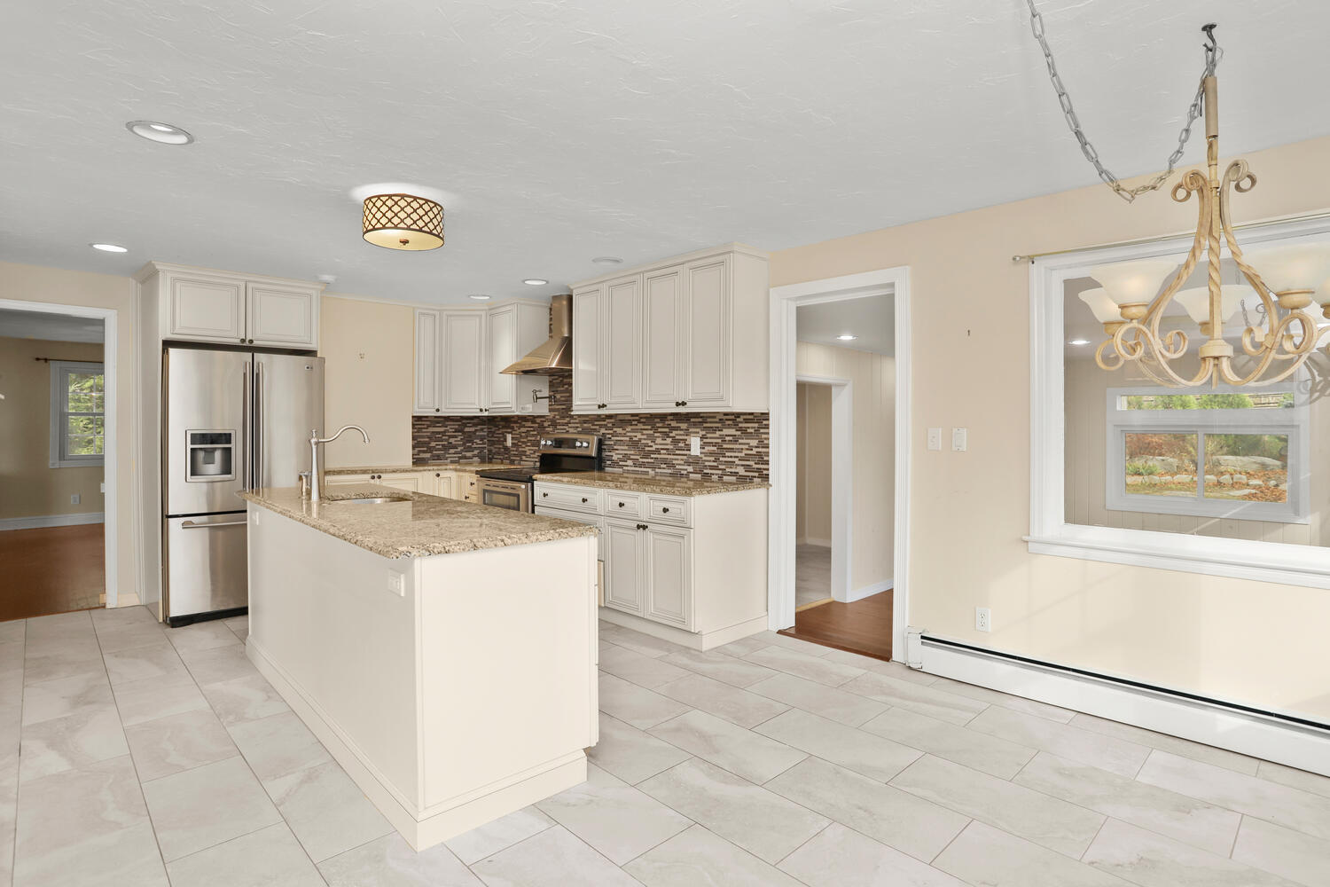 270 Smith Ridge Road New Canaan, CT 06840 - Photo 11 of 36 a kitchen with stainless steel appliances granite countertop a refrigerator a stove and a sink