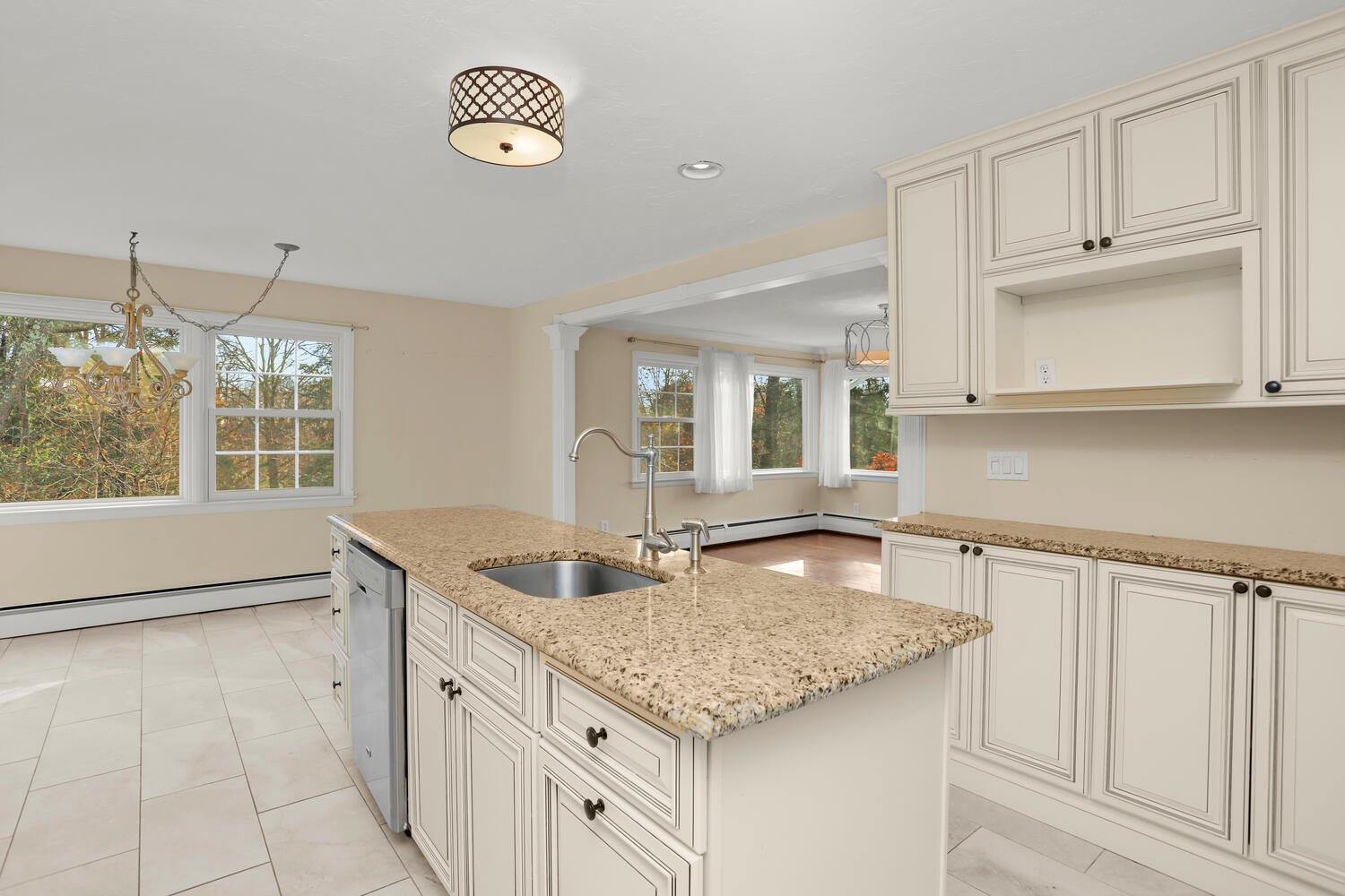 270 Smith Ridge Road New Canaan, CT 06840 - Photo 13 of 36 a kitchen with granite countertop a sink and a stove