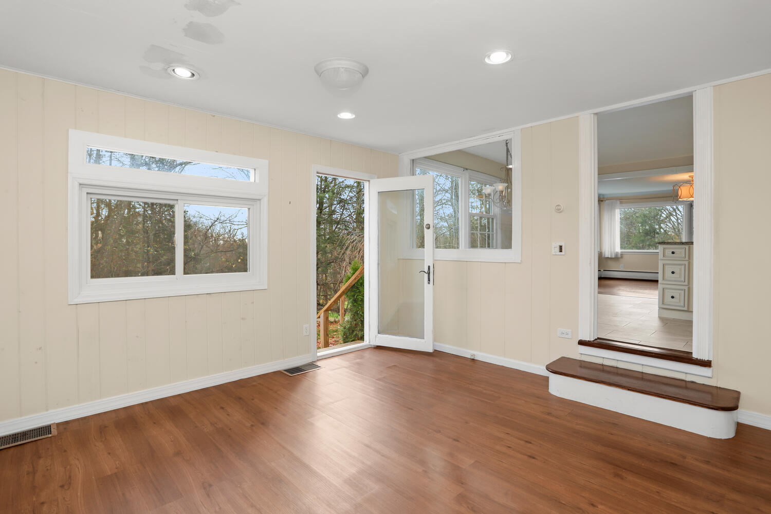 270 Smith Ridge Road New Canaan, CT 06840 - Photo 14 of 36 an empty room with wooden floor and windows