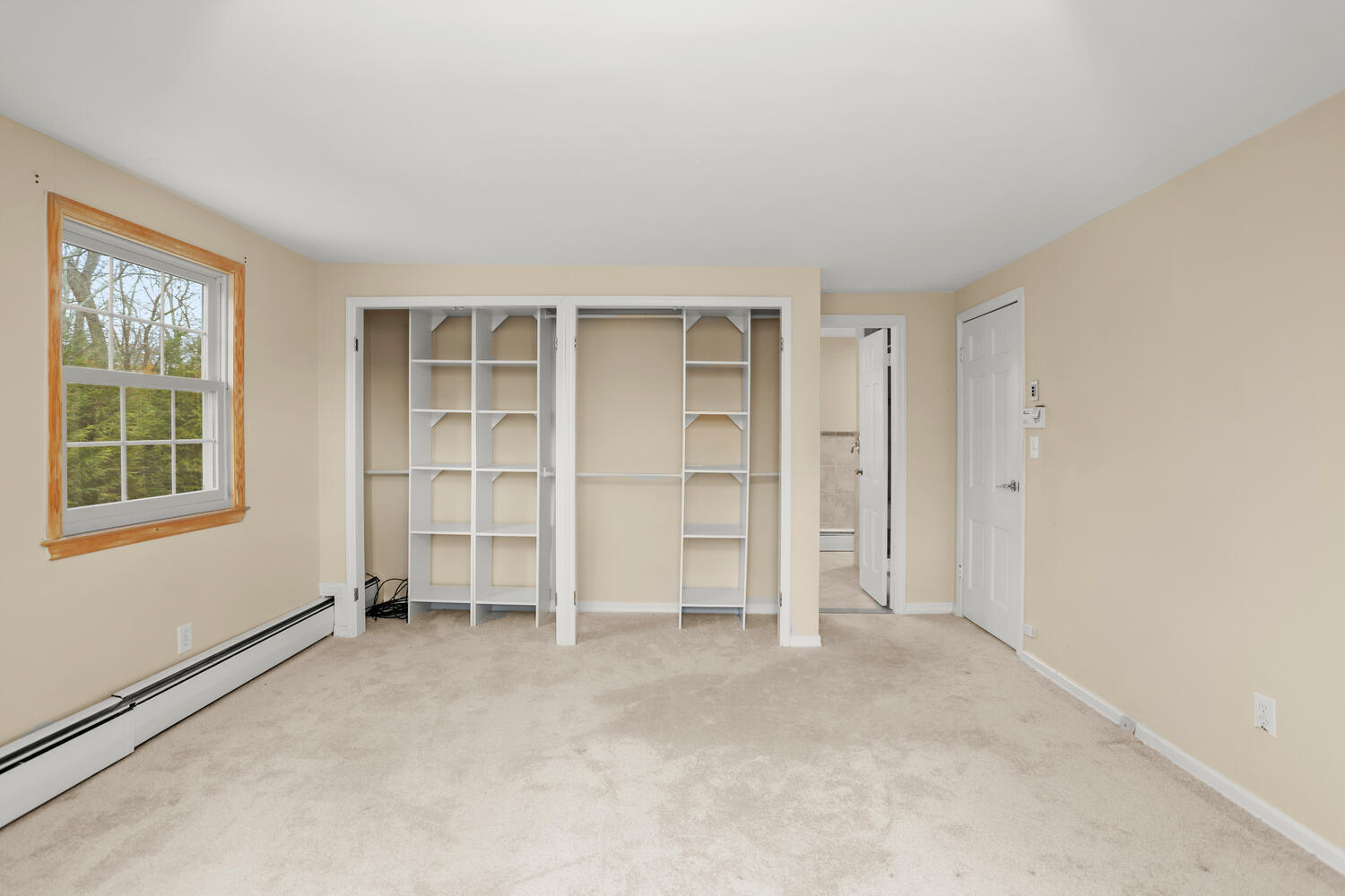 270 Smith Ridge Road New Canaan, CT 06840 - Photo 18 of 36 an empty room with a window and closet