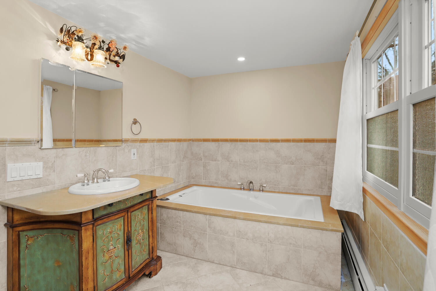 270 Smith Ridge Road New Canaan, CT 06840 - Photo 19 of 36 a bathroom with a sink and a bathtub