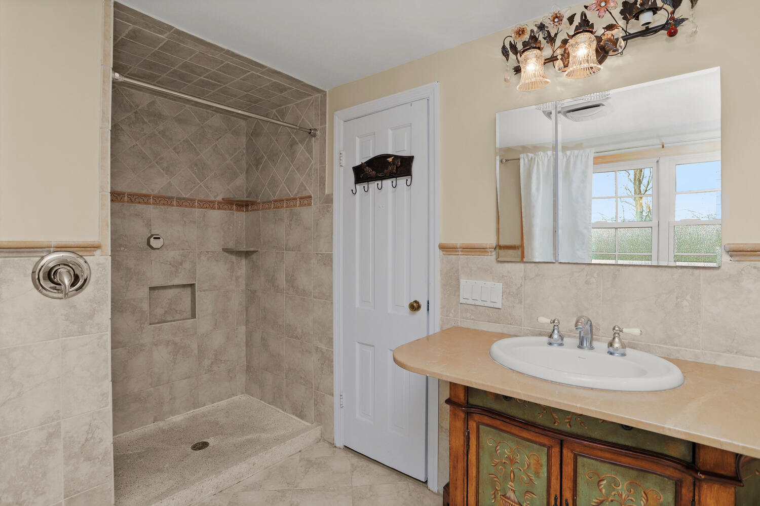 270 Smith Ridge Road New Canaan, CT 06840 - Photo 20 of 36 a bathroom with a sink shower and a mirror