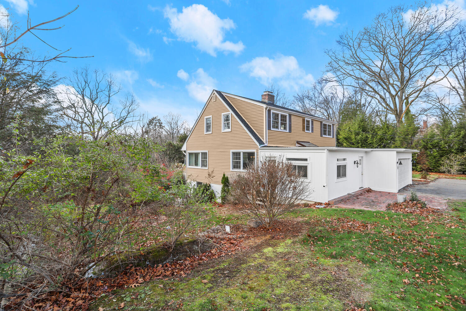 270 Smith Ridge Road New Canaan, CT 06840 - Photo 2 of 36 a front view of a house with garden