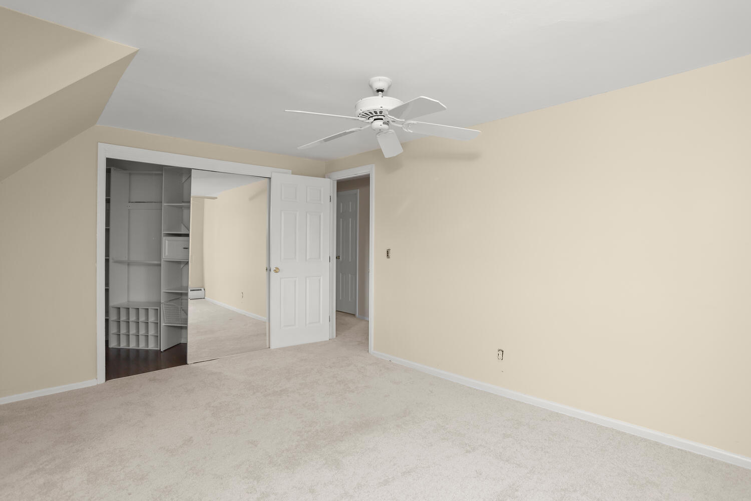 270 Smith Ridge Road New Canaan, CT 06840 - Photo 24 of 36 an empty room with windows and fan