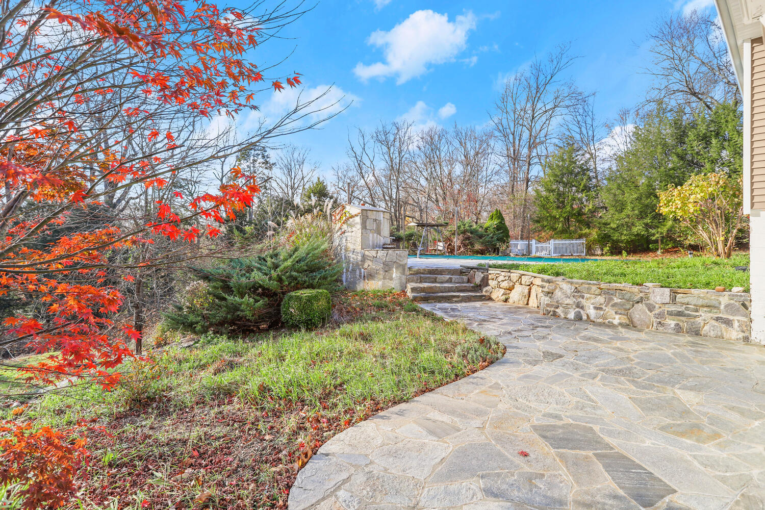 270 Smith Ridge Road New Canaan, CT 06840 - Photo 29 of 36 a front view of a house with a yard