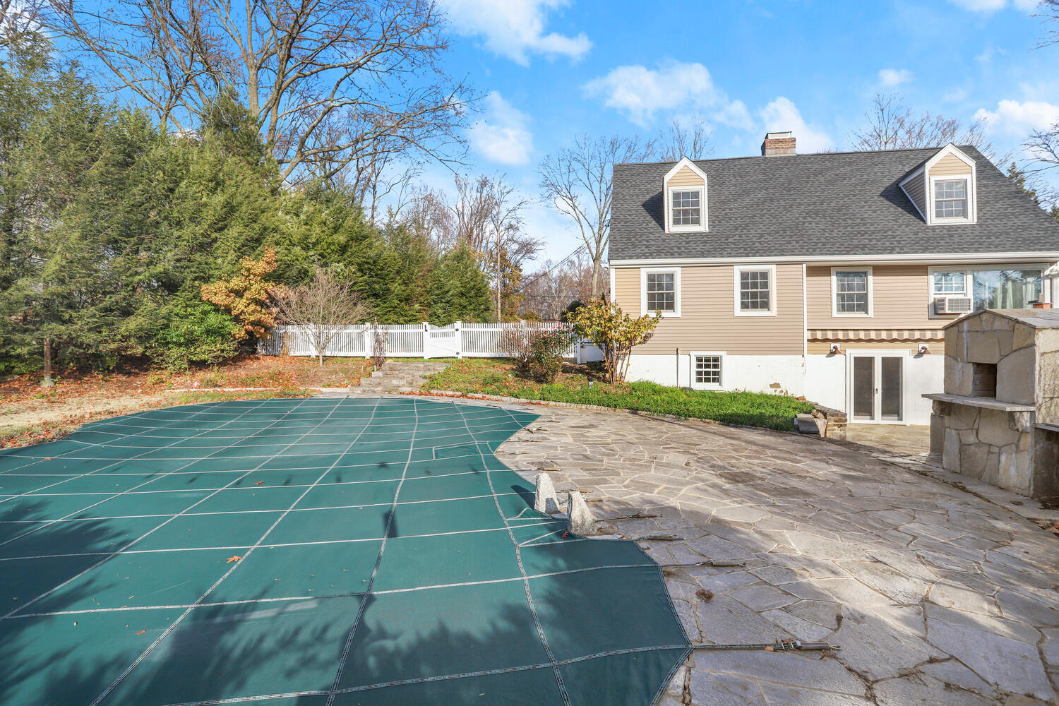 270 Smith Ridge Road New Canaan, CT 06840 - Photo 31 of 36 a view of a brick house with a yard