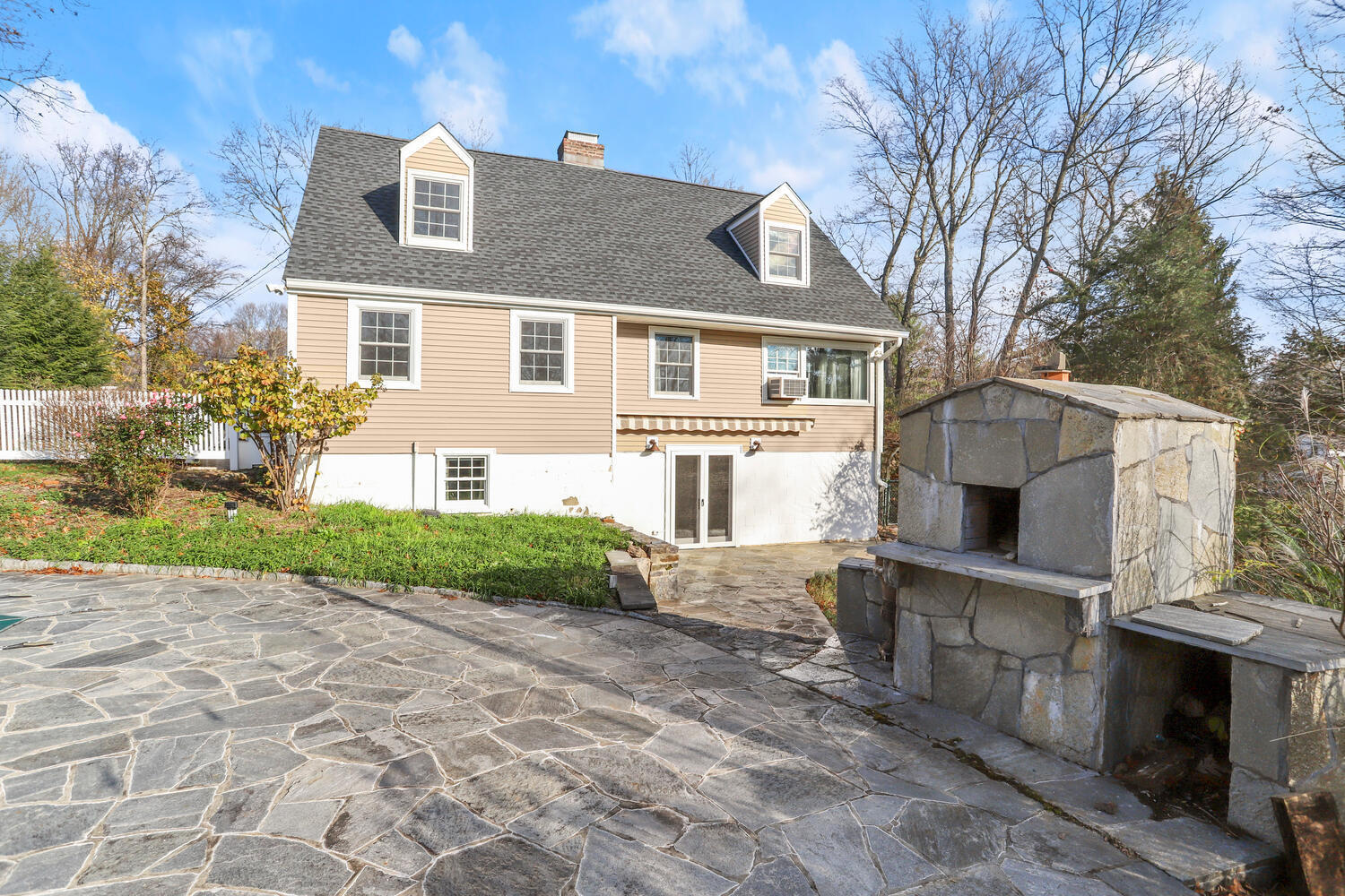 270 Smith Ridge Road New Canaan, CT 06840 - Photo 33 of 36 a view of a house with a yard