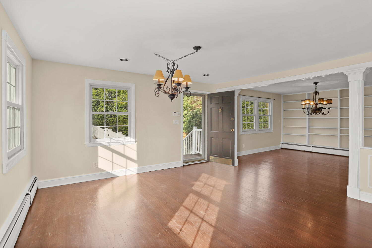 270 Smith Ridge Road New Canaan, CT 06840 - Photo 4 of 36 an empty room with wooden floor and windows