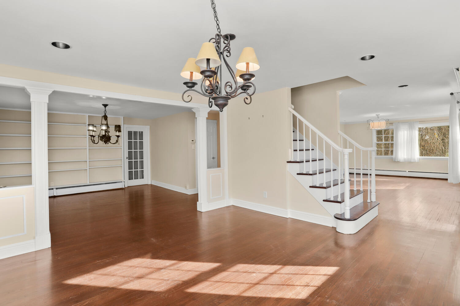 270 Smith Ridge Road New Canaan, CT 06840 - Photo 5 of 36 a view of a hallway with wooden floor and staircase