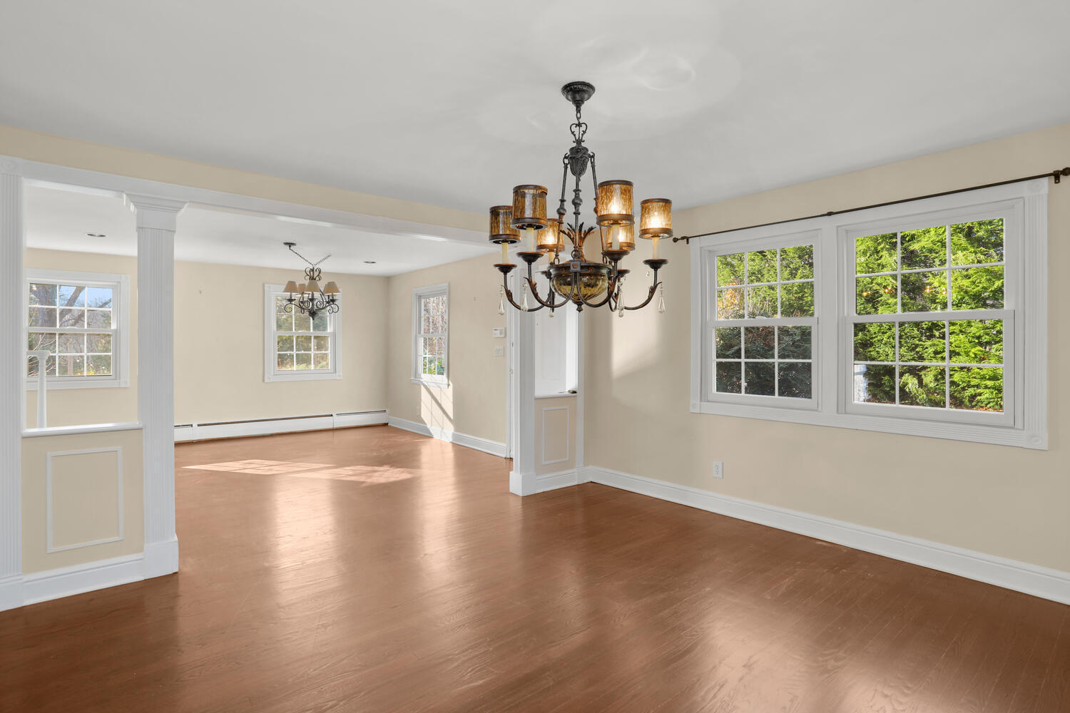 270 Smith Ridge Road New Canaan, CT 06840 - Photo 6 of 36 a view of a room with wooden floor chandelier and windows