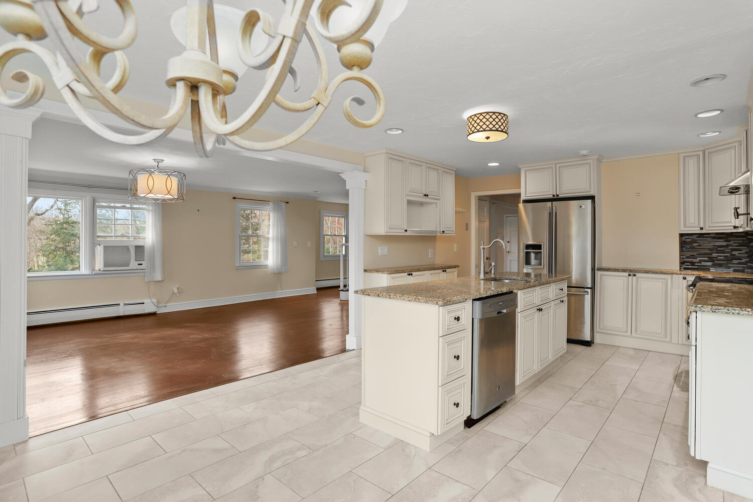 270 Smith Ridge Road New Canaan, CT 06840 - Photo 10 of 36 a kitchen with granite countertop a stove a sink and a refrigerator