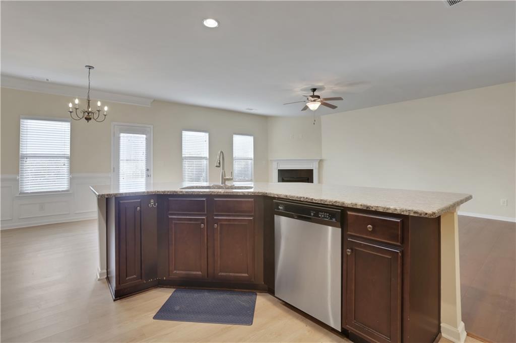 2526 Morgan Chase Drive Buford, GA 30519 - Photo 12 of 44 a spacious bathroom with a granite countertop sink a mirror and a vanity