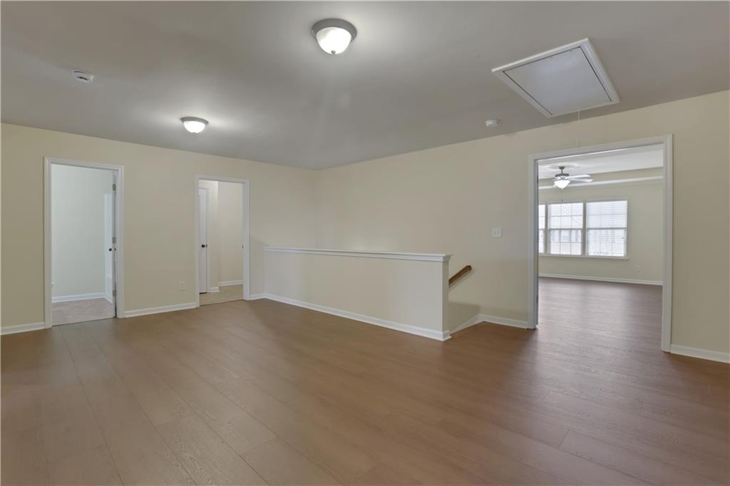 2526 Morgan Chase Drive Buford, GA 30519 - Photo 29 of 44 an empty room with wooden floor and windows