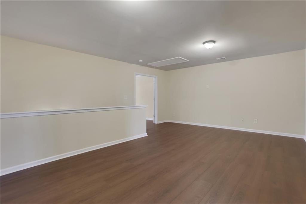 2526 Morgan Chase Drive Buford, GA 30519 - Photo 30 of 44 an empty room with wooden floor