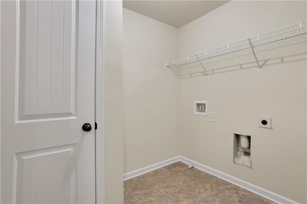 2526 Morgan Chase Drive Buford, GA 30519 - Photo 37 of 44 a view of a room with racks on the wall