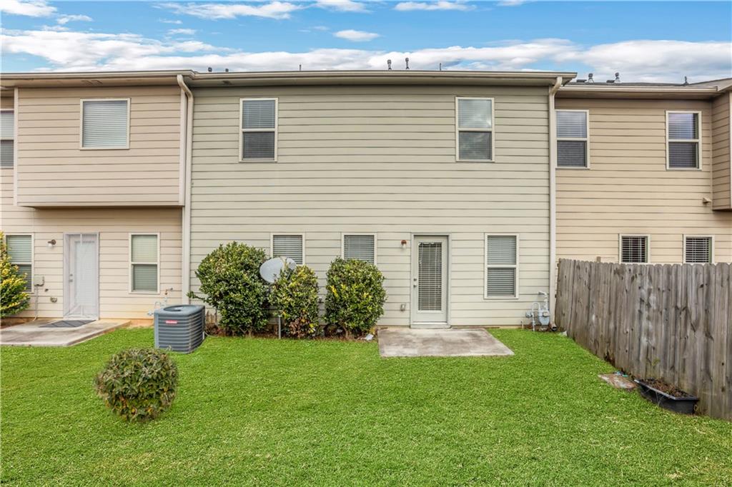 2526 Morgan Chase Drive Buford, GA 30519 - Photo 40 of 44 a front view of a house with a yard
