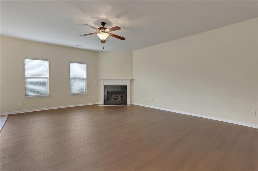 2526 Morgan Chase Drive Buford, GA 30519 - Photo 5 of 44 a view of an empty room with a fireplace and a window