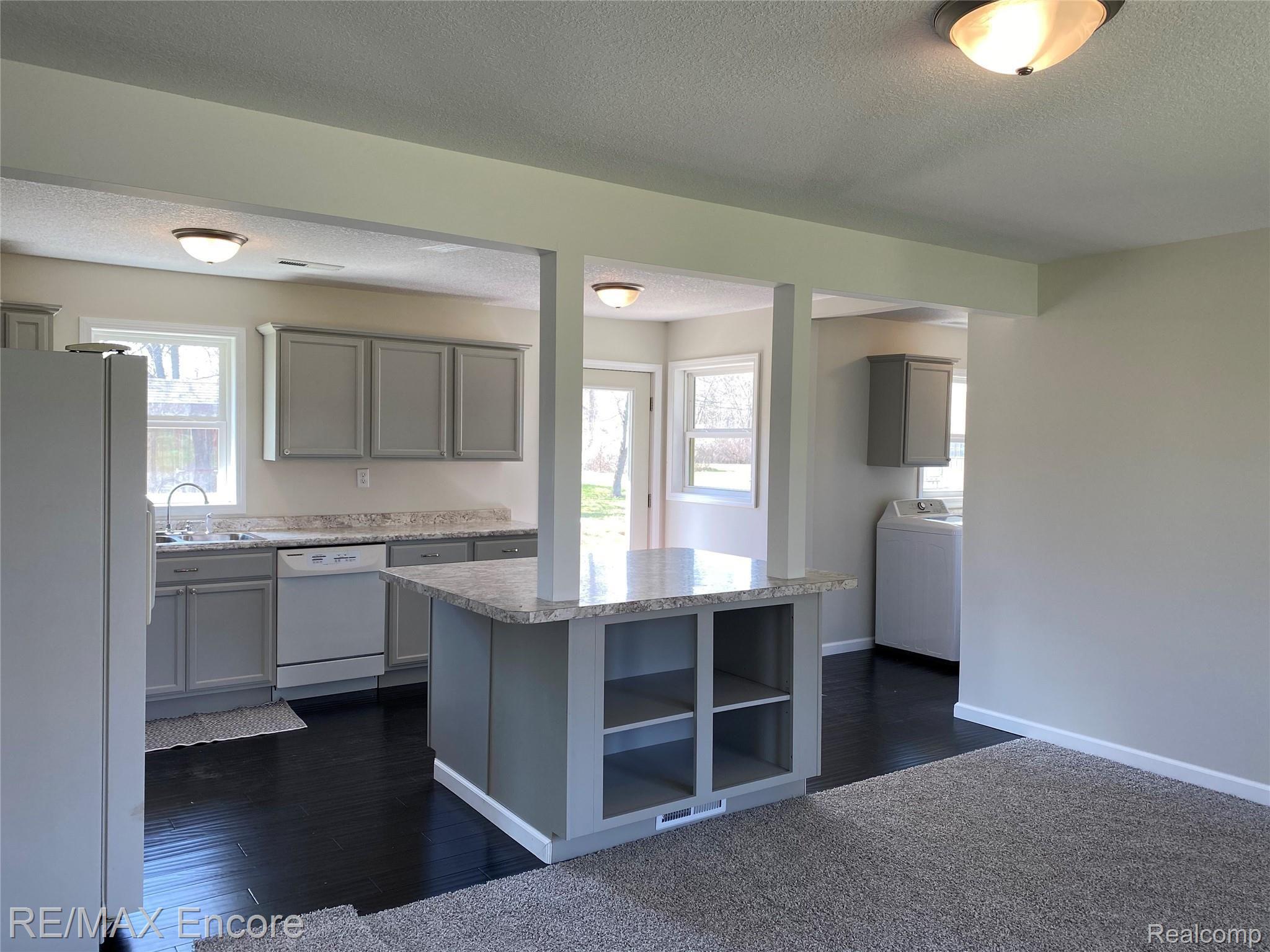 8060 Newburg Road Durand, MI 48429 - Photo 6 of 41 Welcome home! Everything has been tastefully updated. Photo from front door looking into living room and kitchen.