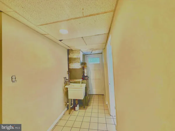 a view of a bathroom with a sink and a mirror