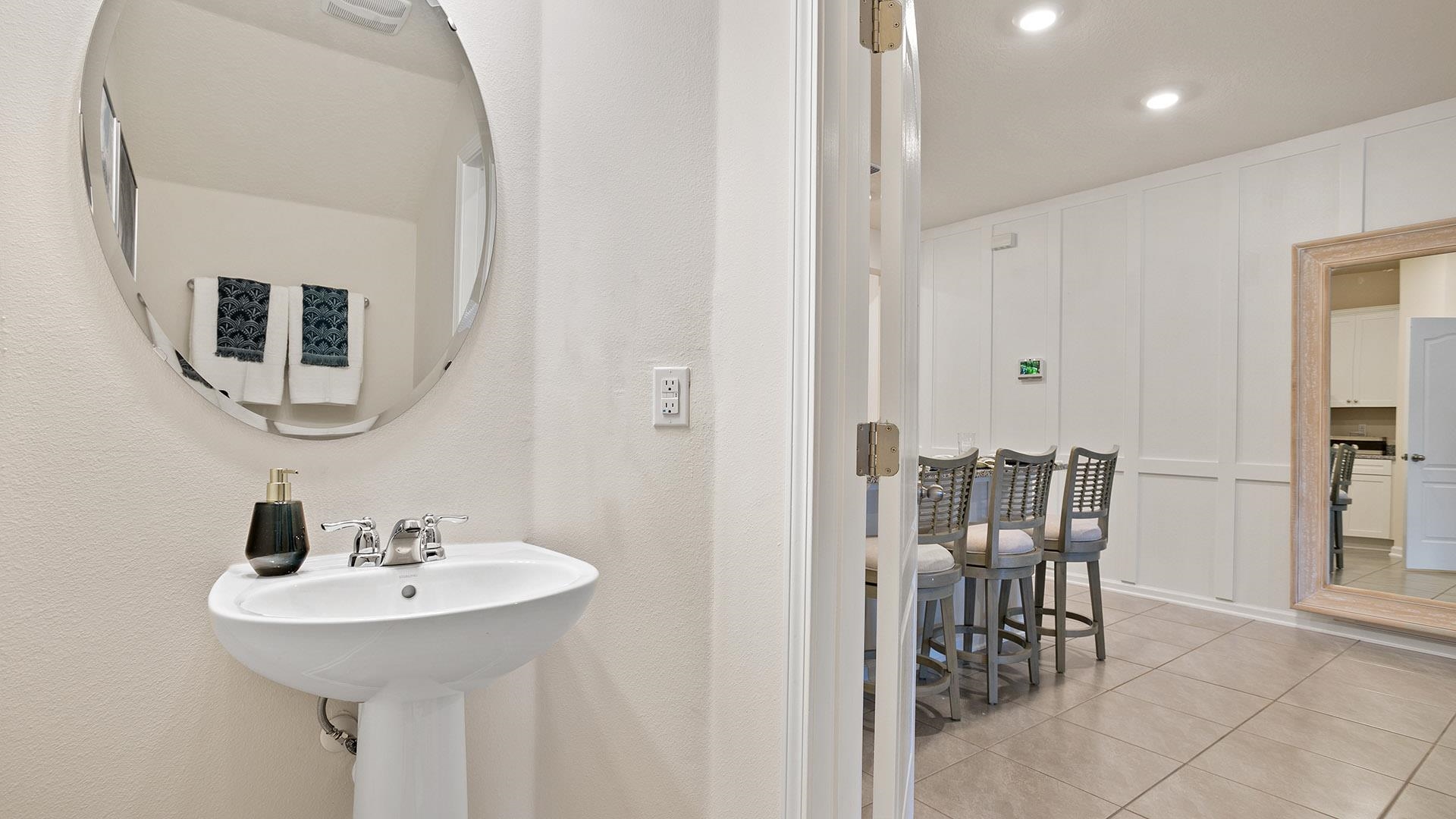 327 Redbud Road Palm Coast, FL 32137 - Photo 20 of 33 a bathroom with a sink and a mirror