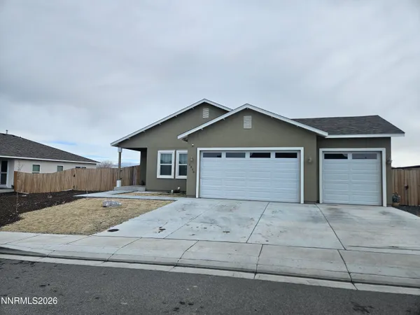 a front view of a house with yard