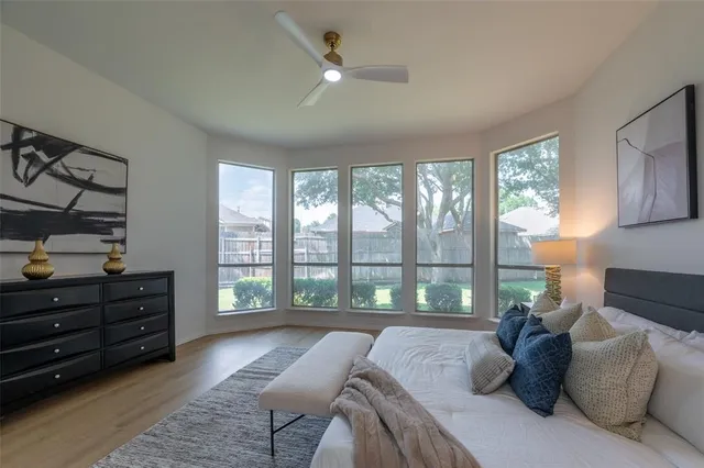 a bed room with a bed and a window